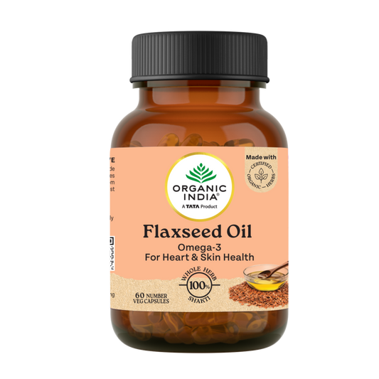 Bottle of Organic India Flaxseed Oil capsules on a white background